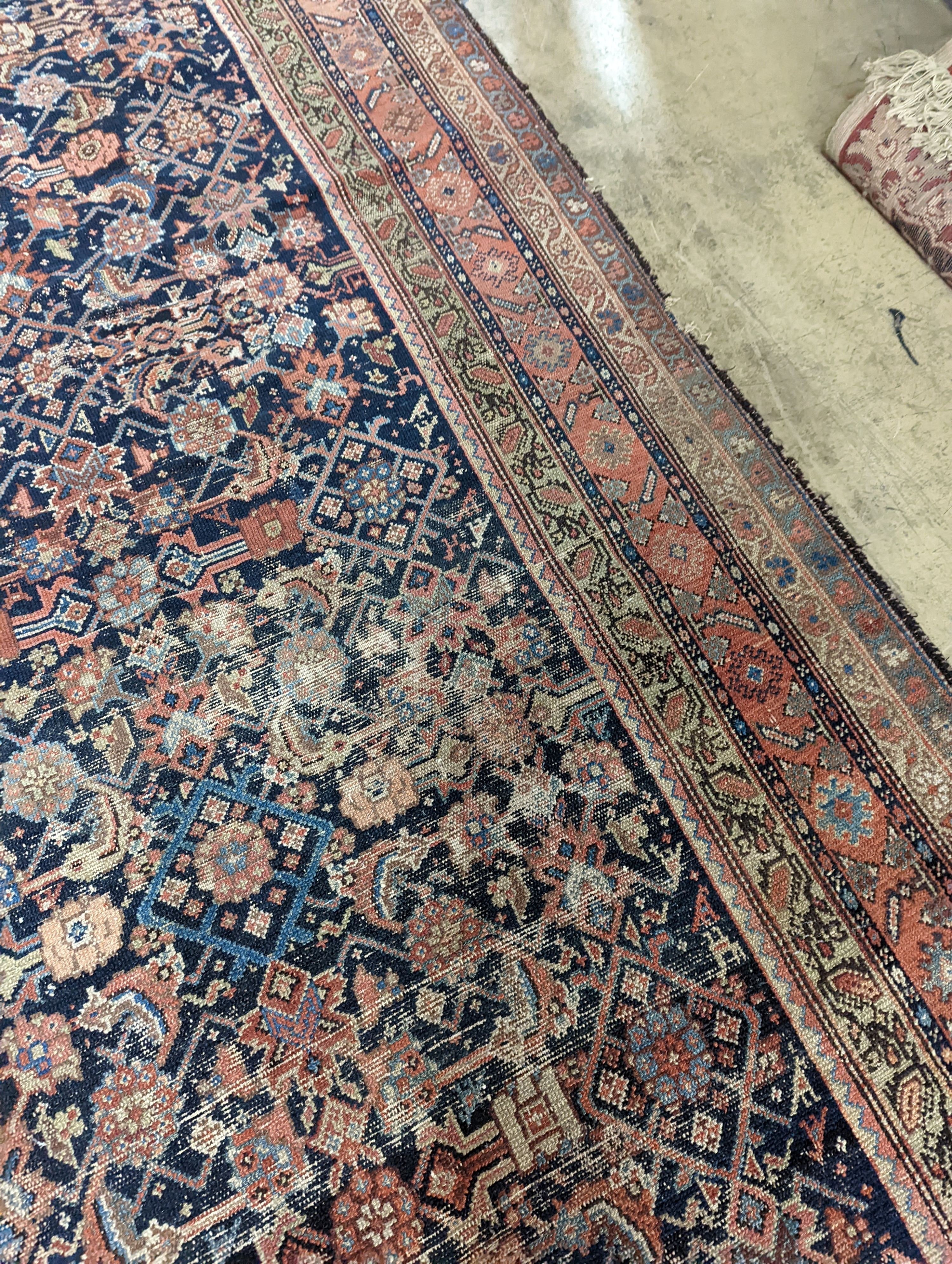 A Ferraghan blue and red brick carpet, 345 x 161cm